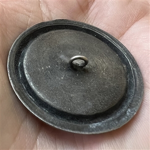 French white metal button of the devil sitting on an alligator.