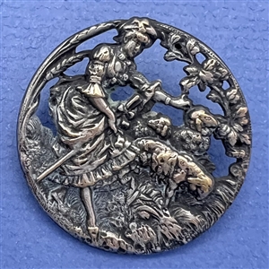 Silvered brass button of shepherdess and lambs.