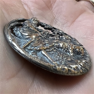 Silvered brass button of shepherdess and lambs.