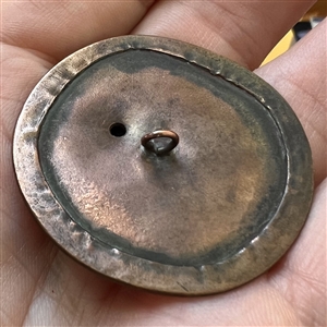 Large handmade copper and brass button of a buffalo.
