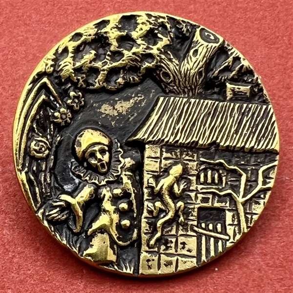 SCARCE - Brass button of clown watching a lizard on side of a house.