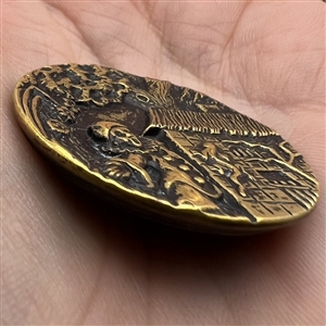 SCARCE - Brass button of clown watching a lizard on side of a house.