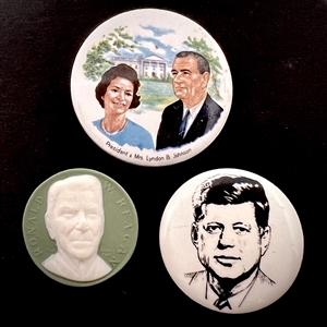 Three assorted ceramic buttons of U.S. presidents.