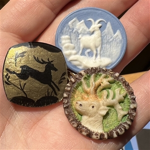 Three assorted buttons  - deer and a goat.