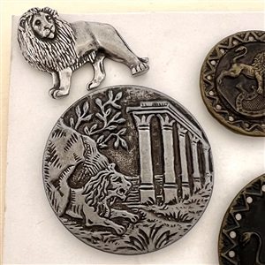Six assorted metal buttons of lions.