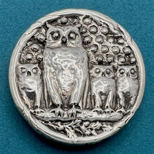 Unusual cast silver button of “Owl Family.”