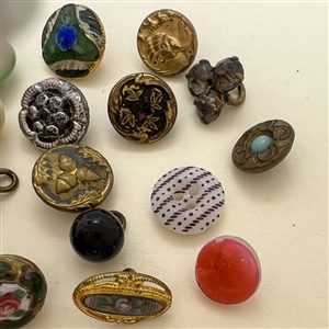 Twenty one diminutive and small buttons.