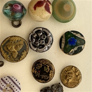 Twenty one diminutive and small buttons.