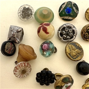 Twenty one diminutive and small buttons.