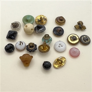 Twenty one diminutive and small buttons.