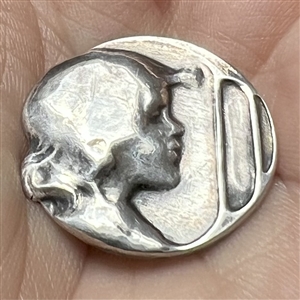 Kate Harris’s Arts & Crafts Hallmarked silver button of child’s head