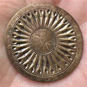 An 18th c. Heavily chased copper Colonial button of a sunburst.