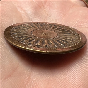An 18th c. Heavily chased copper Colonial button of a sunburst.