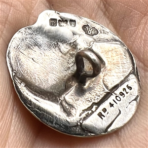Kate Harris’s Arts & Crafts Hallmarked silver button of child’s head