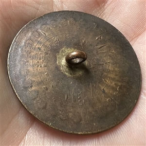 An 18th c. Heavily chased copper Colonial button of a sunburst.