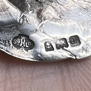 Kate Harris’s Arts & Crafts Hallmarked silver button of child’s head