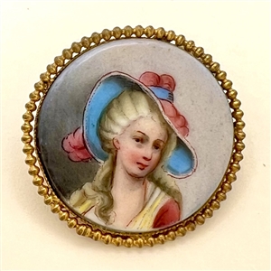 Porcelain button of women in blue and pink hat.
