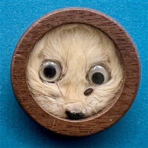 Studio button of “Ermine” with real ermine fur by Chris Shreve.