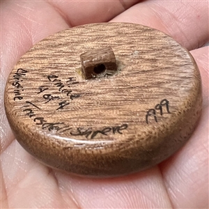Studio button of “Ermine” with real ermine fur by Chris Shreve.
