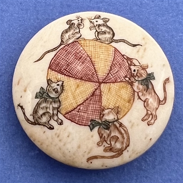 Kittens going after mice natural material button.