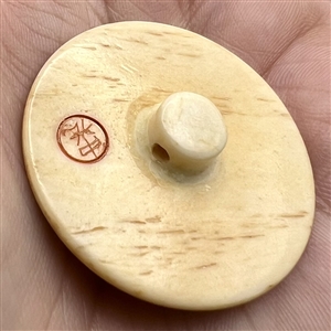 Kittens going after mice natural material button.