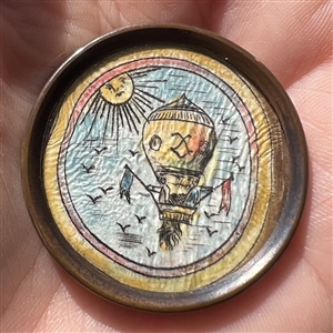 Hot air balloon - ink and paint on paper under glass button.