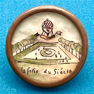 Hot air balloon with verbal - ink and paint on paper under glass button.