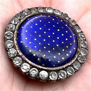 A 19th c. Cobalt enamel button with paste border set in silver.