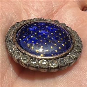 A 19th c. Cobalt enamel button with paste border set in silver.
