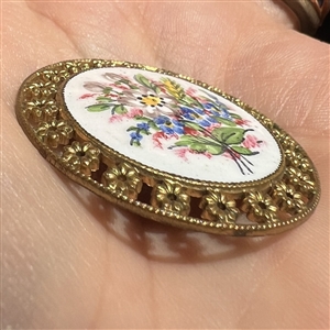 A 19th c. Enamel button of bouquet of wild flowers.
