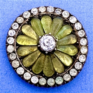 A 19th c. iridescent chartreuse glass set in metal button with faceted pastes.