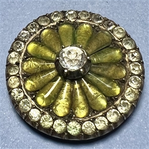 A 19th c. iridescent chartreuse glass set in metal button with faceted pastes.