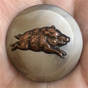 Sporting button of a wild boar.