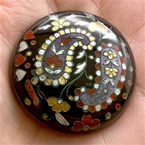 Two design under glass buttons.