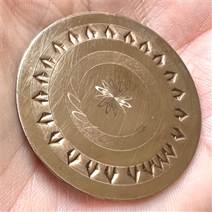 An 18th c. chased copper Colonial button.