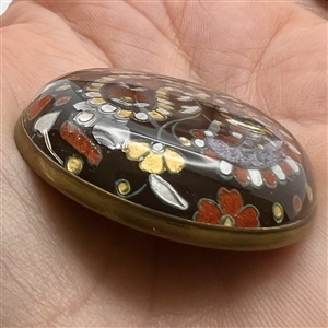 Two design under glass buttons.
