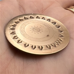 An 18th c. chased copper Colonial button.