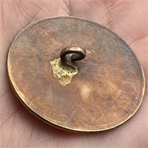 An 18th c. chased copper Colonial button.