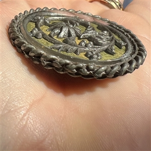 Two design under glass buttons.