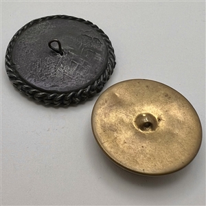 Two design under glass buttons.