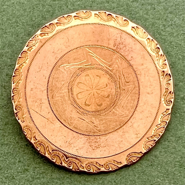 An 18th c. chased copper Colonial button.