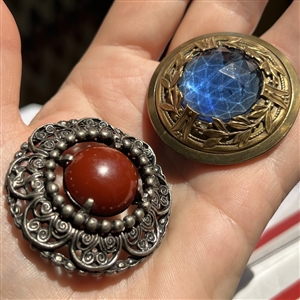 Two gay 90’s type buttons.
