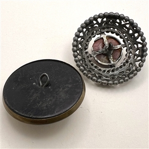 Two gay 90’s type buttons.