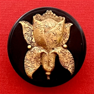 Vintage Bakelite button with unusual brass flower.