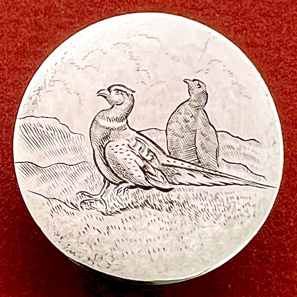 A 19th c. Hallmarked silver sporting button of engraved pheasants. 