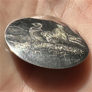 A 19th c. Hallmarked silver sporting button of engraved pheasants. 