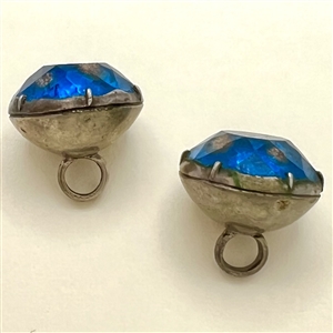 Two buttons of faceted aqua glass with goldstone.