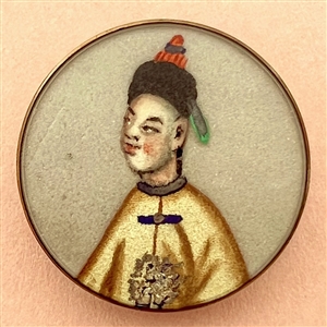 Painting on fabric button of an Asian man.