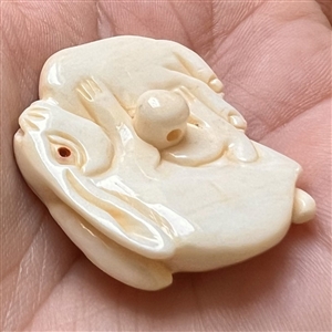 White rabbits Netsuke style natural material button.
