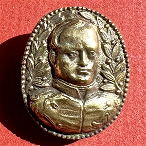 Cast white metal button of Napoleon.